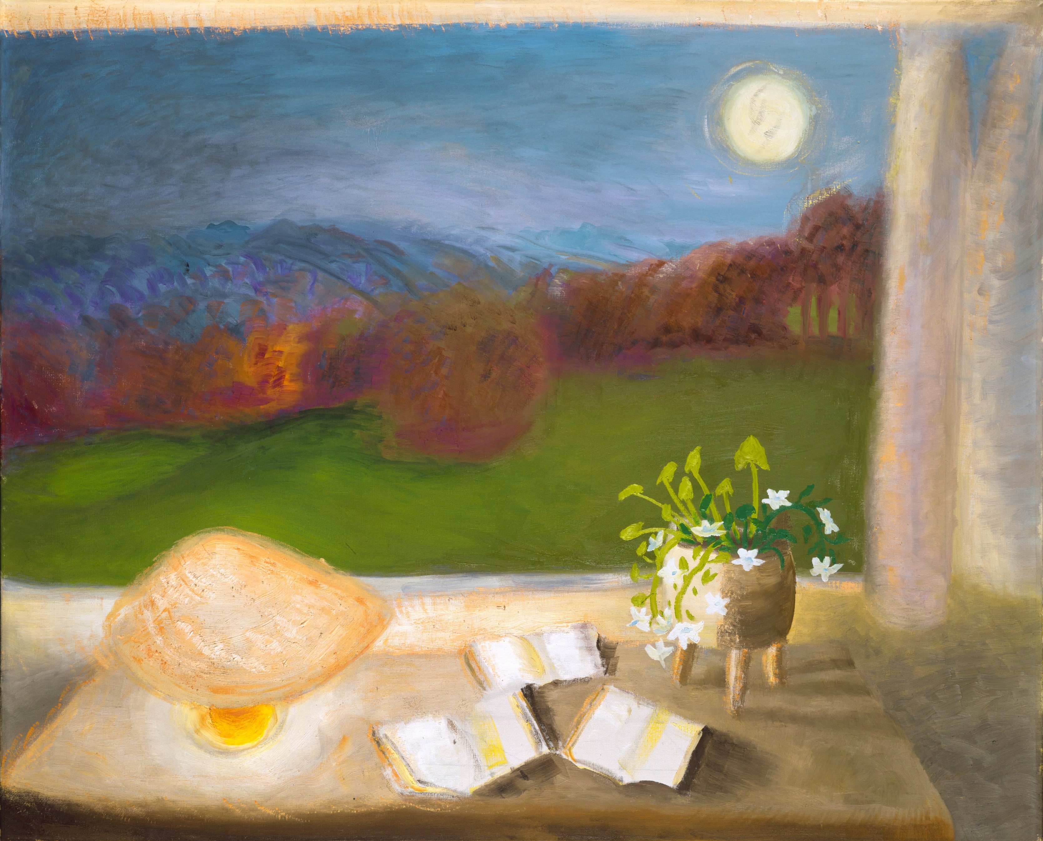 Painting. The light of a low lamp warms the surface of a table or desk in front of an open window. The twilight or nighttime landscape beyond has a band of raspberry-pink and bronze-brown trees and shrubs across a grassy field. Loosely painted indigo-blue mountains line the horizon under a periwinkle-blue sky. A sorbet-yellow moon hangs low in the sky to our right.
