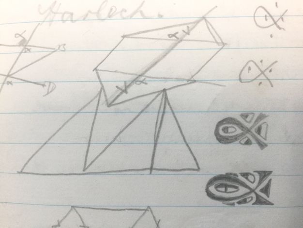 Drawing. Geometric shapes and looping forms are doodled on lined paper.